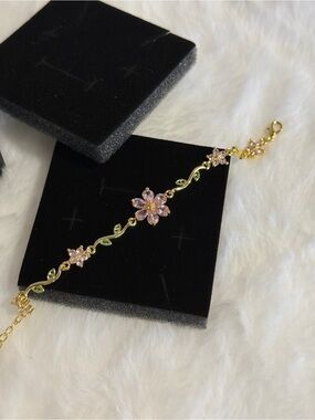 Gold-Tone Pink Flower Bracelet with Green Accents